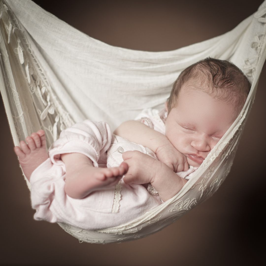 Newborn baby in hammock