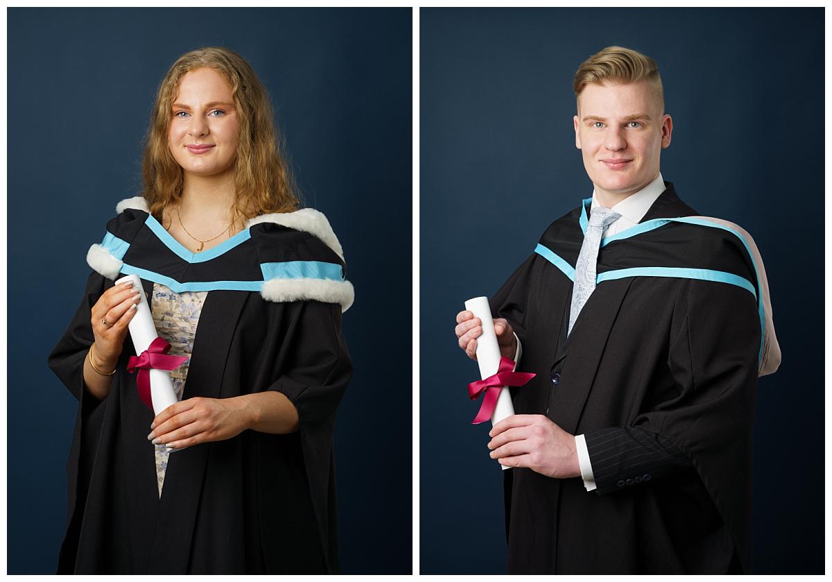 Professional Graduation photograph taken by Northern Ireland's top Graduation photographer in Belfast of a brother and sister wearing their undergraduate gowns in Law and Arts from Queens University on a navy blue background