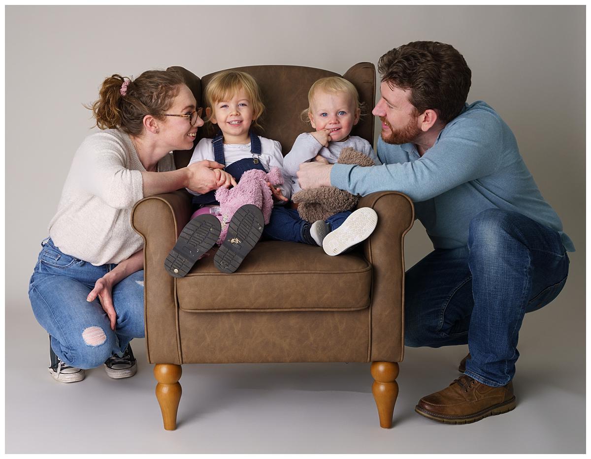 Professional Family photograph taken by one of Northern Ireland's top Family photographers in Belfast of parents and their 2 young children